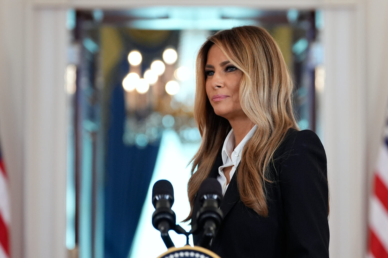 First lady Melania Trump turns from the podium after speaking in the Grand Foyer of the White House...