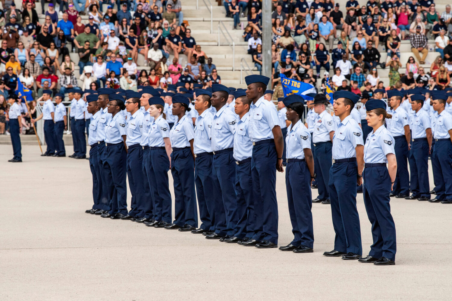 FILE - The front row of 14 graduates, part of a group who graduated from basic training and were sw...