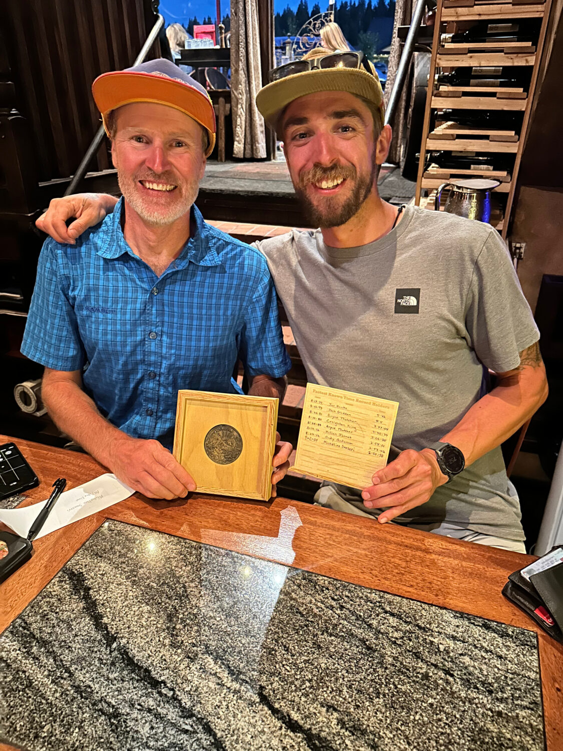 Michelino Sunseri, right, accepts a ceremonial belt buckle from Andy Anderson on Sept. 6, 2024, in ...