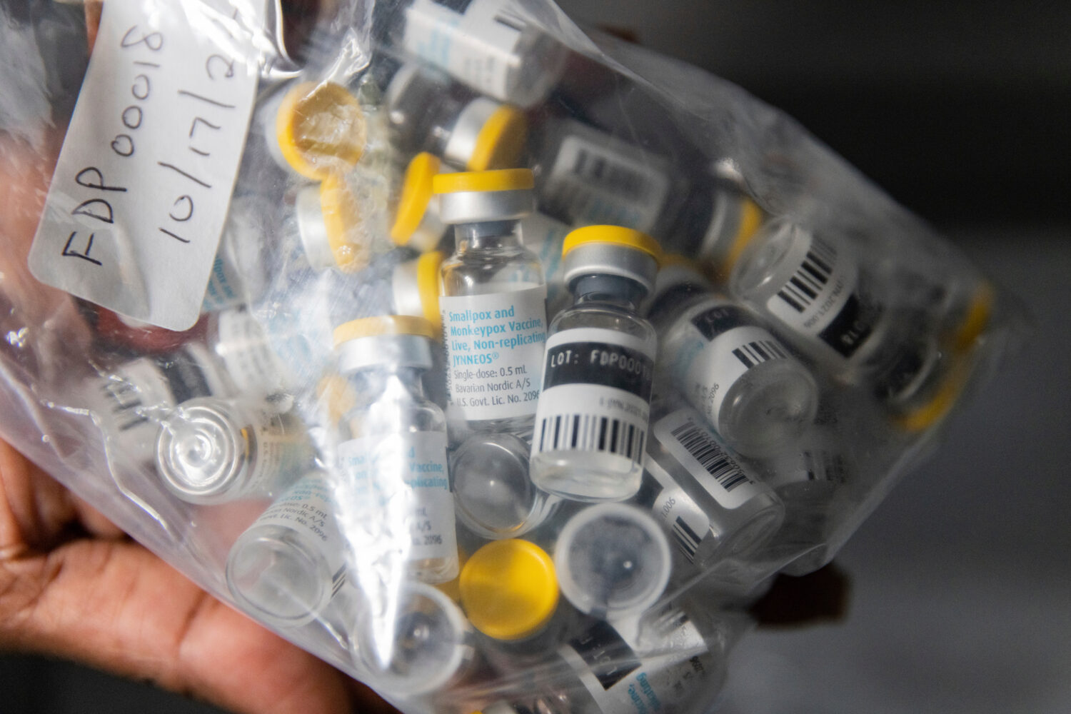 FILE - Vials of the Jynneos vaccine for monkeypox are taken from a cooler at a vaccinations site, A...