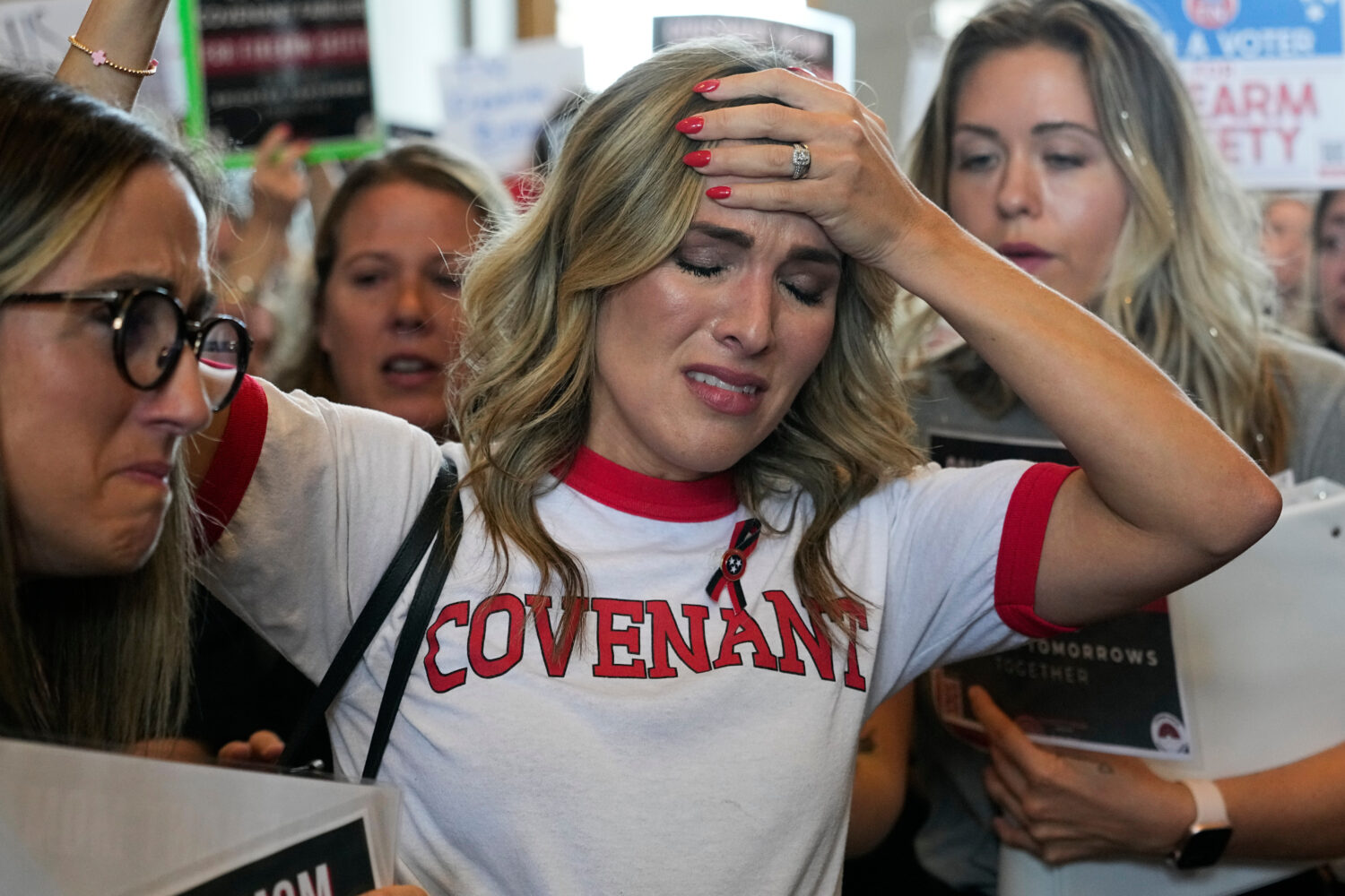 FILE - Covenant School parent Mary Joyce is overcome with emotion as she speaks outside the House c...