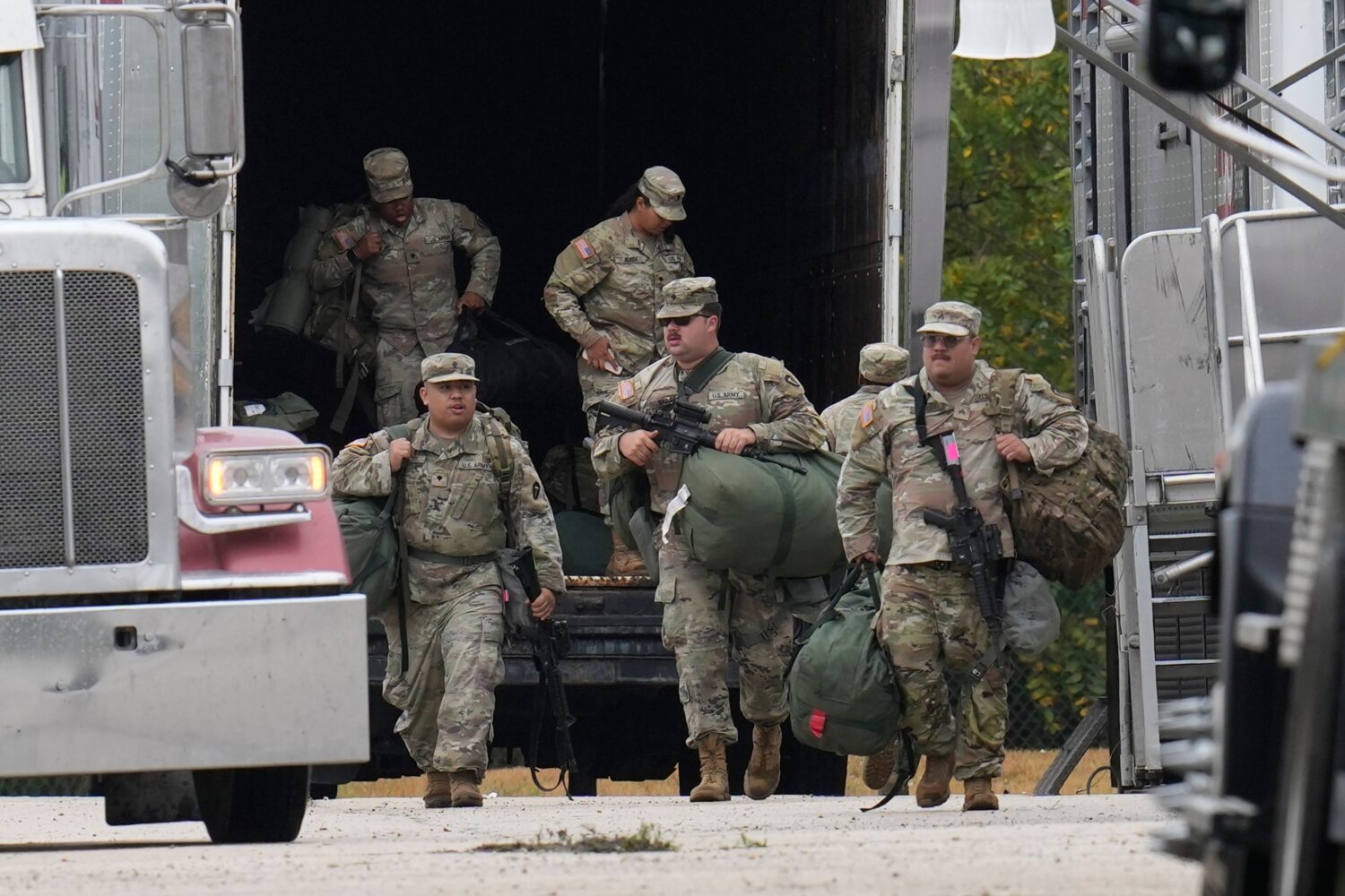 Military personnel in uniform, with the Texas National Guard patch on, are seen at the U.S. Army Re...