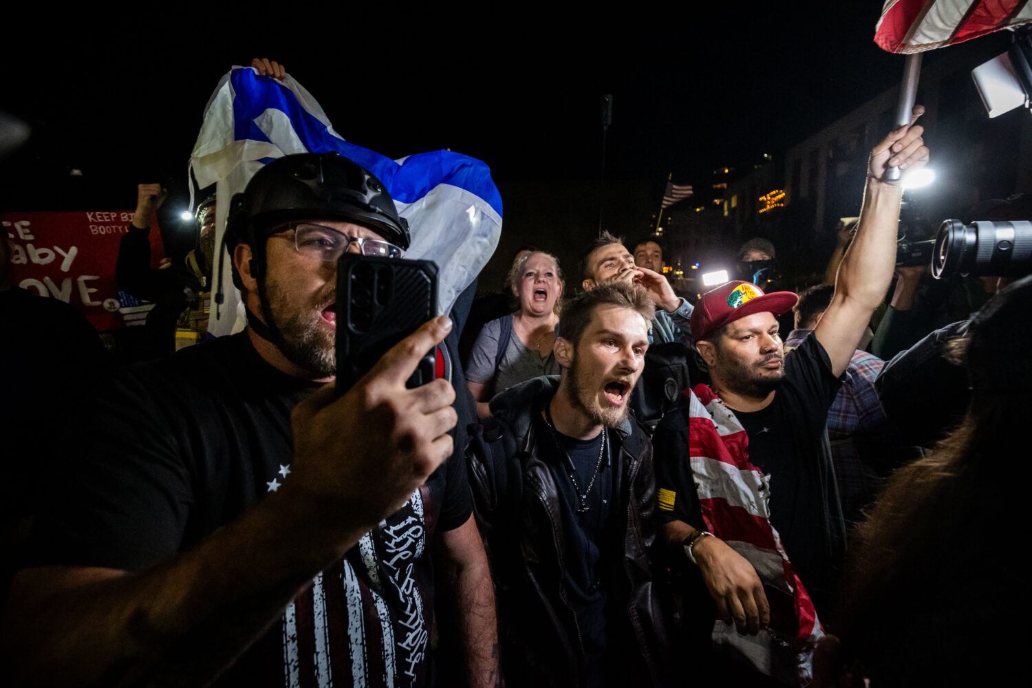Trump supporters face off with protesters outside a U.S. Immigration and Customs Enforcement facili...