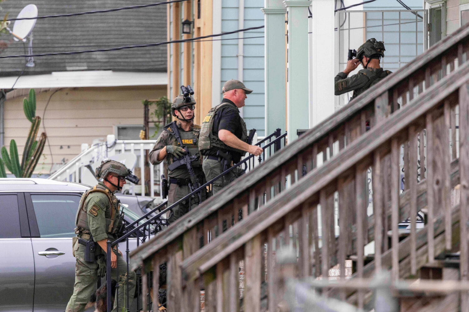 FILE - Law enforcement search for a fugitive that escaped a prison in New Orleans, May 21, 2025. (C...