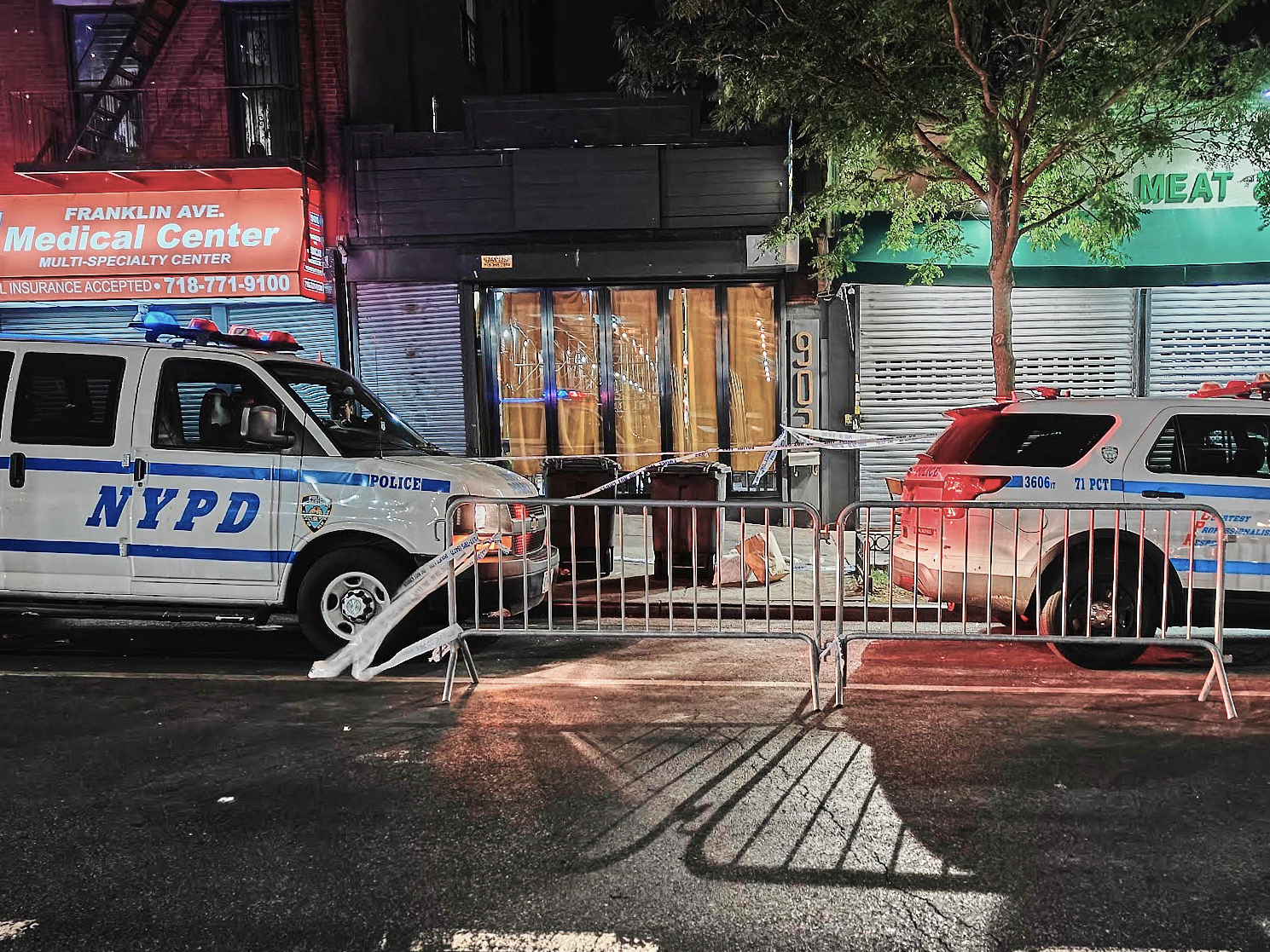FILE - New York City Police Department vehicles secure the entrance to the Taste of the City Lounge...