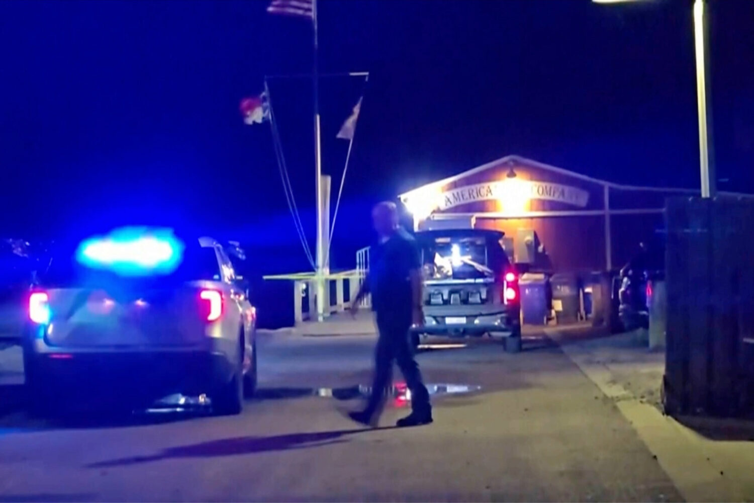 In this photo taken from WWAY-TV video, police work the scene after a shooting in Southport, N.C., ...