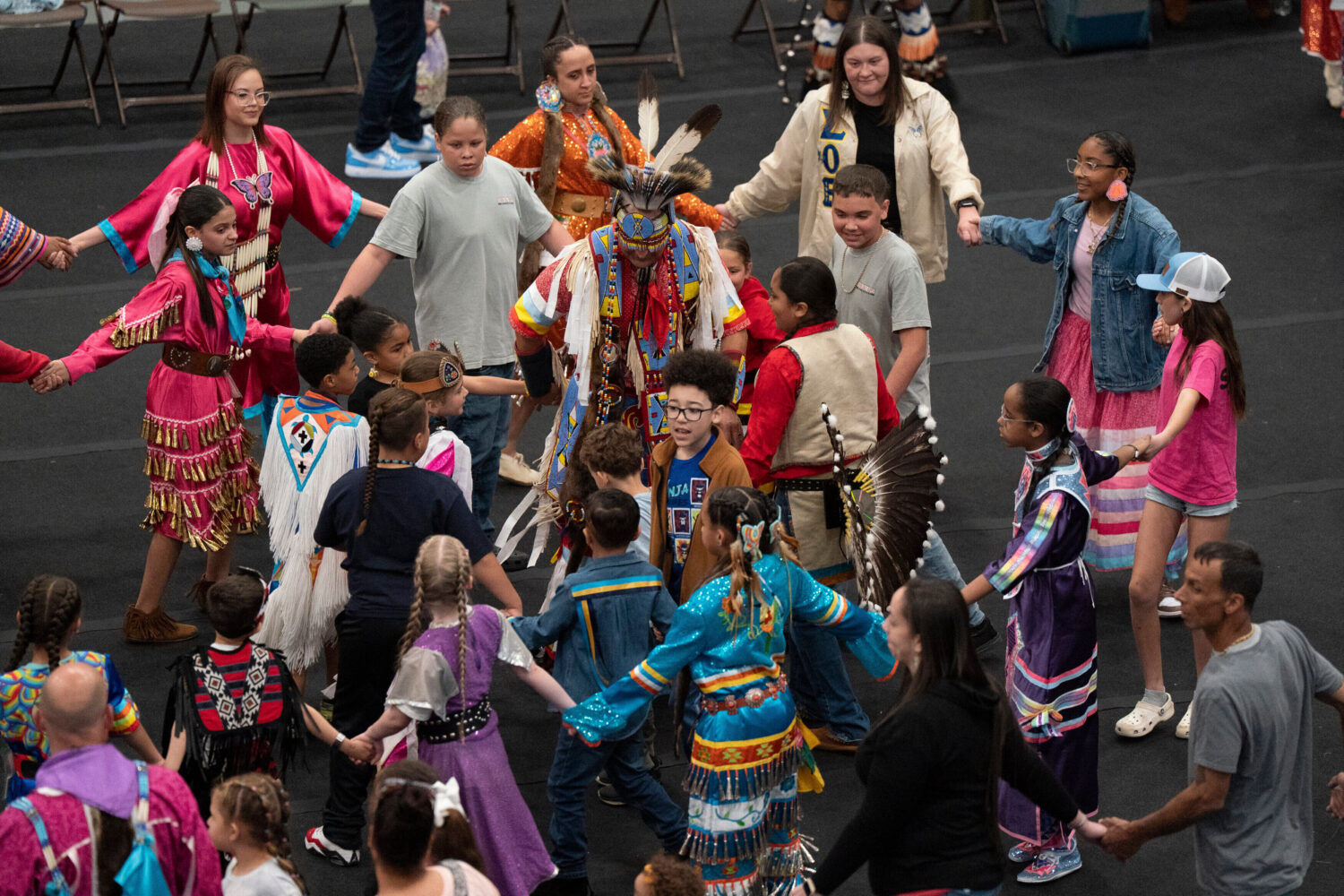 FILE - People participate during the BraveNation Powwow and Gather at UNC Pembroke, March 22, 2025,...