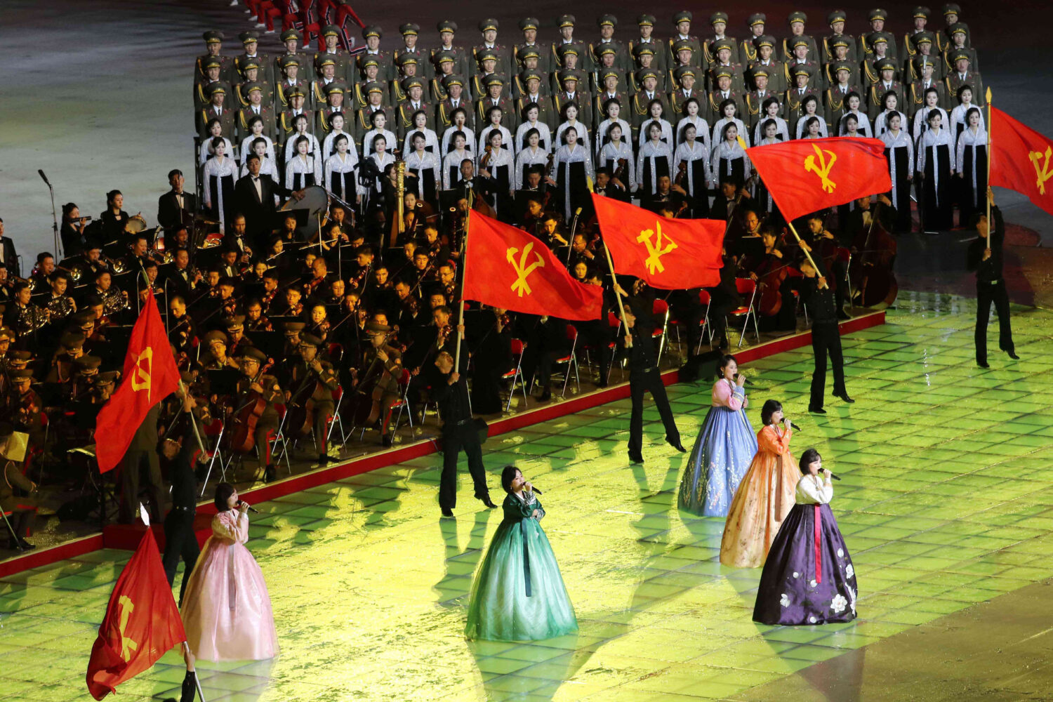 People perform during the ceremony marking the 80th anniversary of the founding of the ruling Worke...