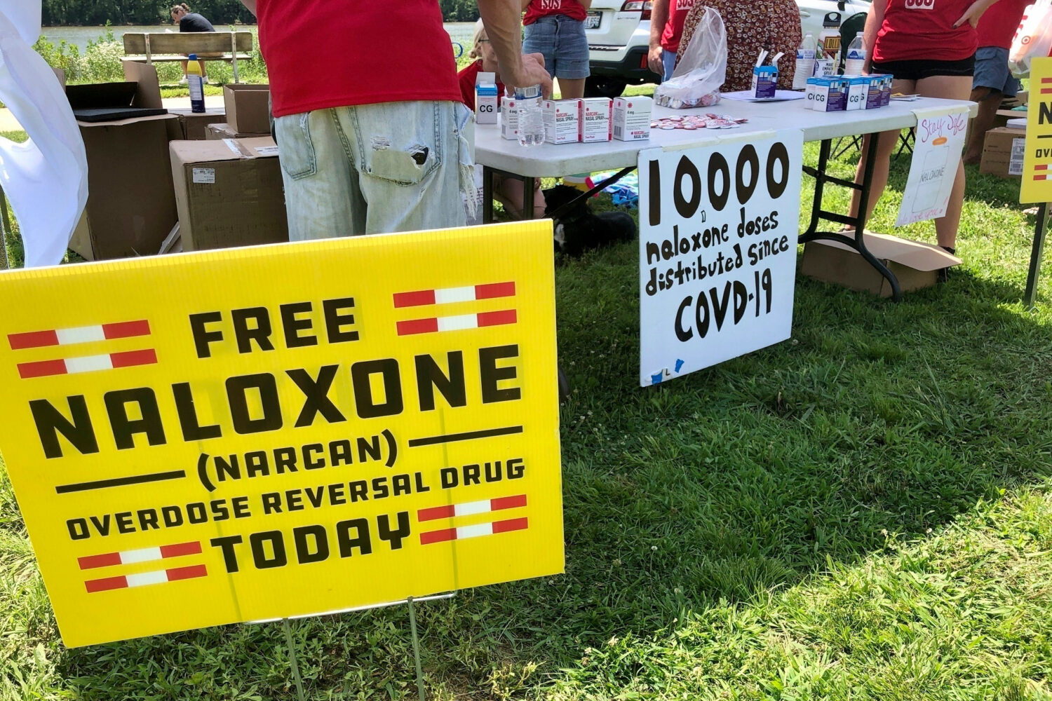 FILE - Signs are displayed at a tent during a health event June 26, 2021, in Charleston, W.Va. (AP ...