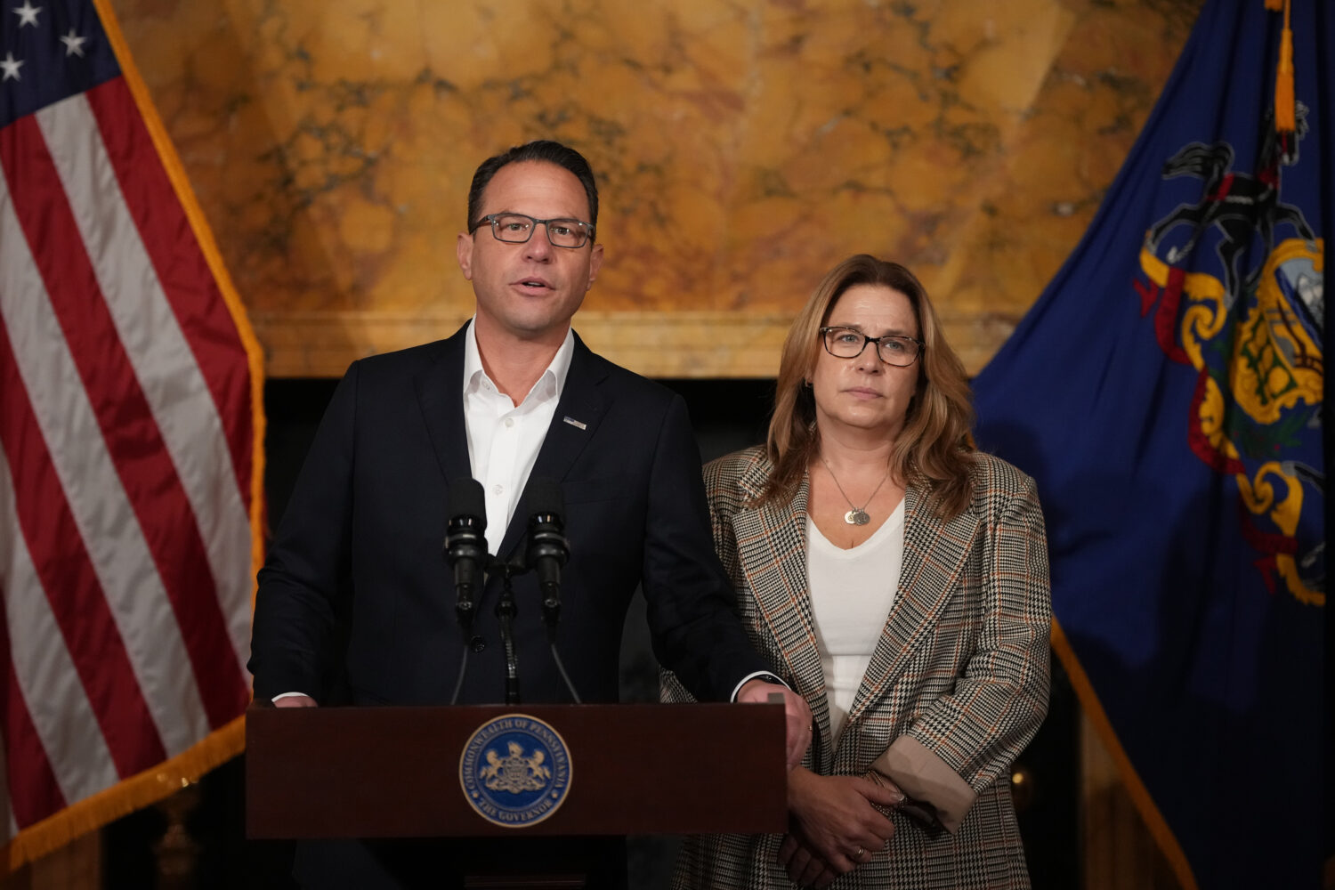 Pennsylvania Gov. Josh Shapiro, accompanied by his wife Lori Shapiro, speaks during a news conferen...