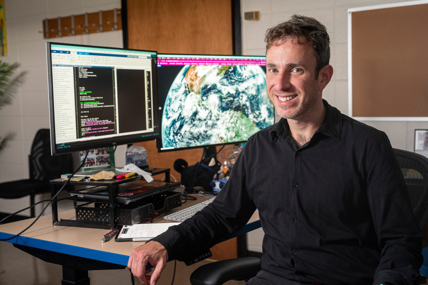 University of Wisconsin-Madison professor Ángel F. Adames Corraliza sits for a portrait in his off...