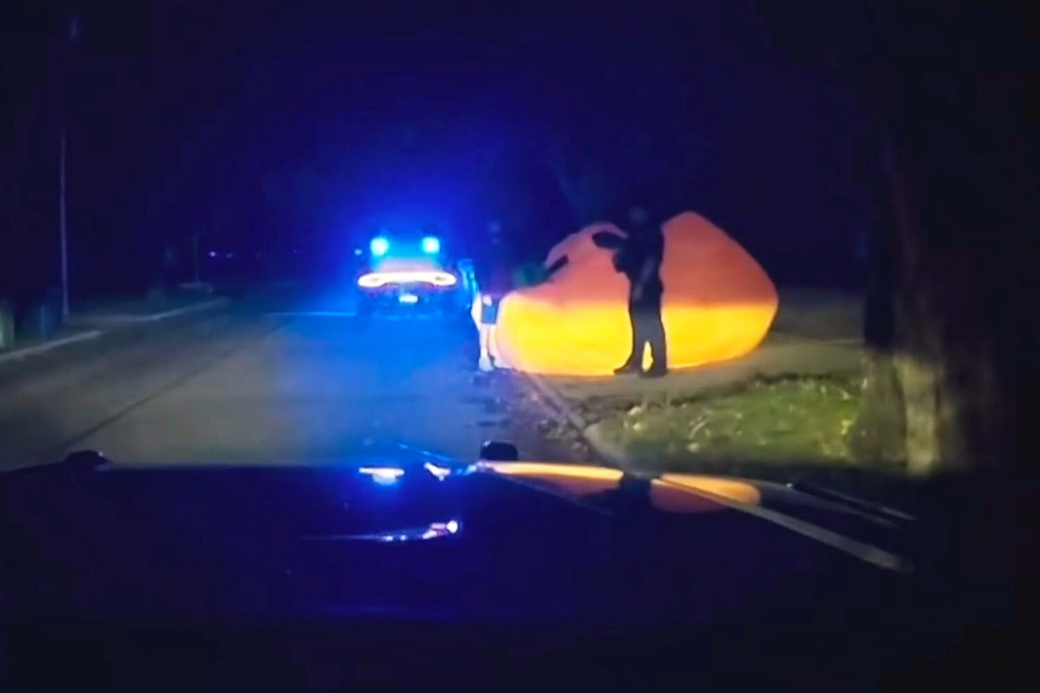 This image made from a Parma Heights Police Department body camera video shows a police officer app...