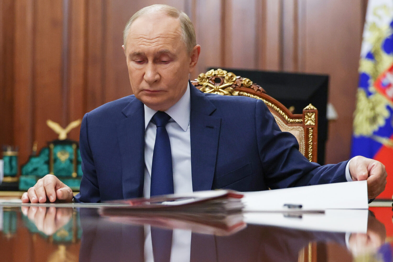Russian President Vladimir Putin attends a meeting with Russian Deputy Prime Minister Dmitri Patrus...