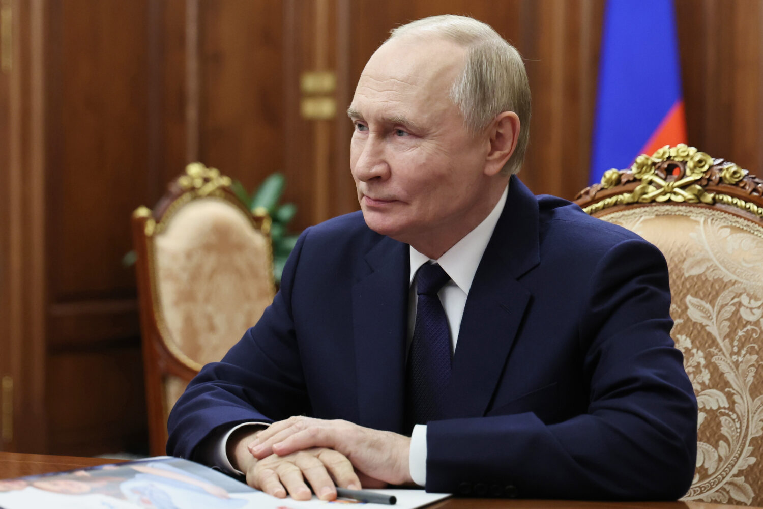 Russian President Vladimir Putin listens to Governor of the Yamal-Nenets Autonomous Area Dmitry Art...