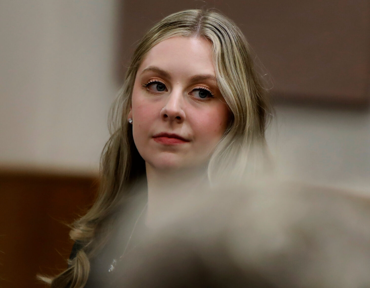 Former Richneck Elementary School teacher Abby Zwerner looks back into the courtroom during her civ...