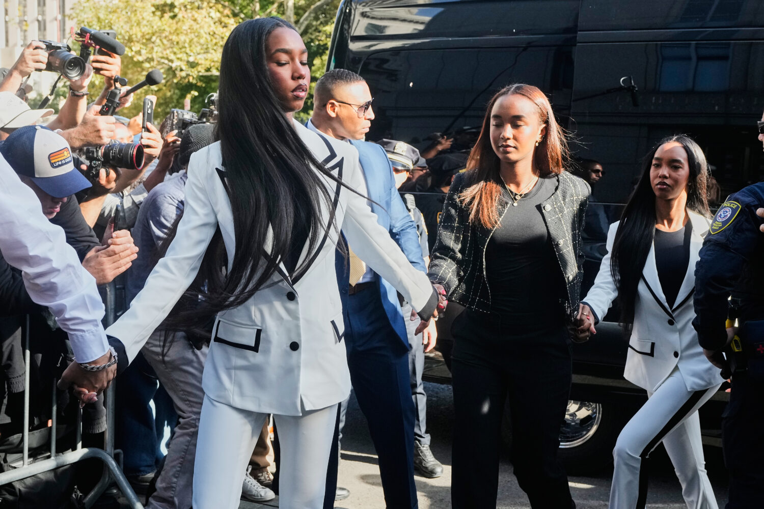 The twin daughters of Sean "Diddy" Combs, arrive at Federal Court, in New York, Friday, Oct. 3, 202...