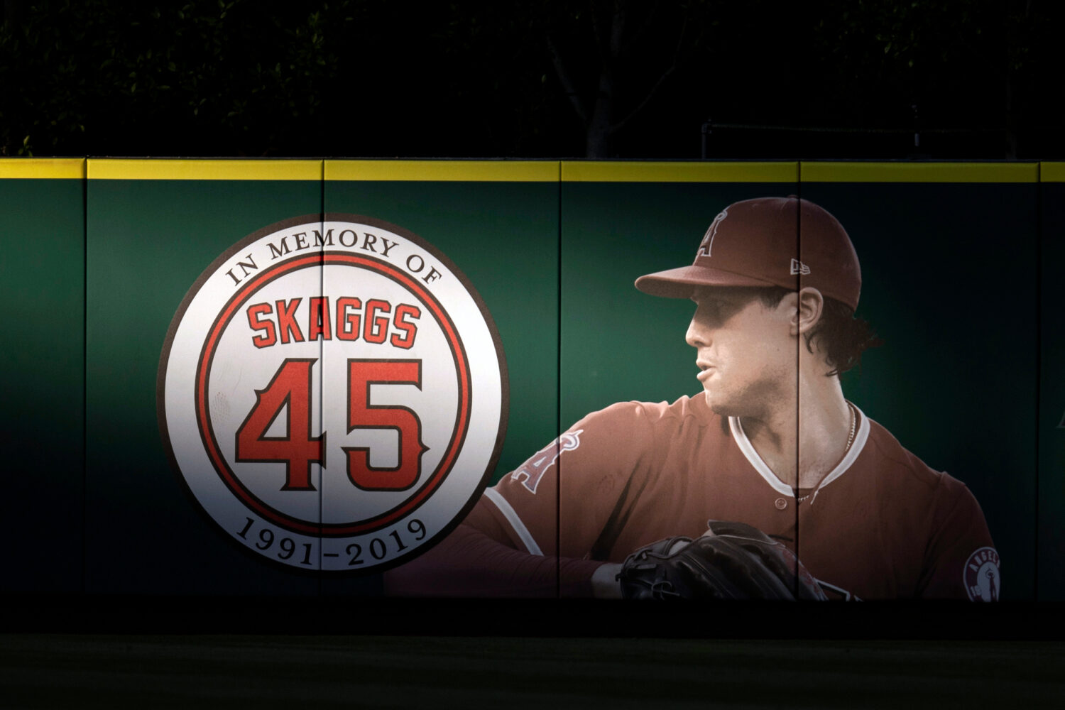 FILE - An image and logo memorializing former Los Angeles Angels pitcher Tyler Skaggs is displayed ...