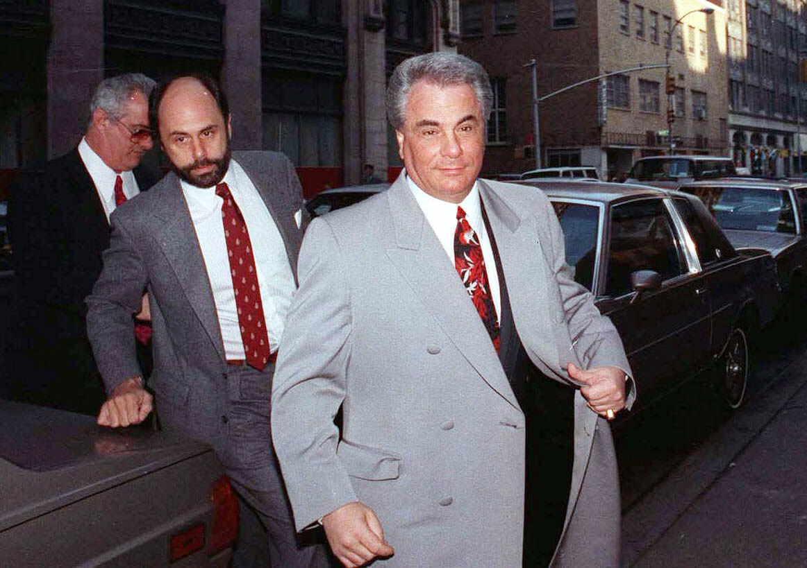 FILE - John Gotti, right, arrives at court with his attorney Attorney Gerald Schargel, center, and ...