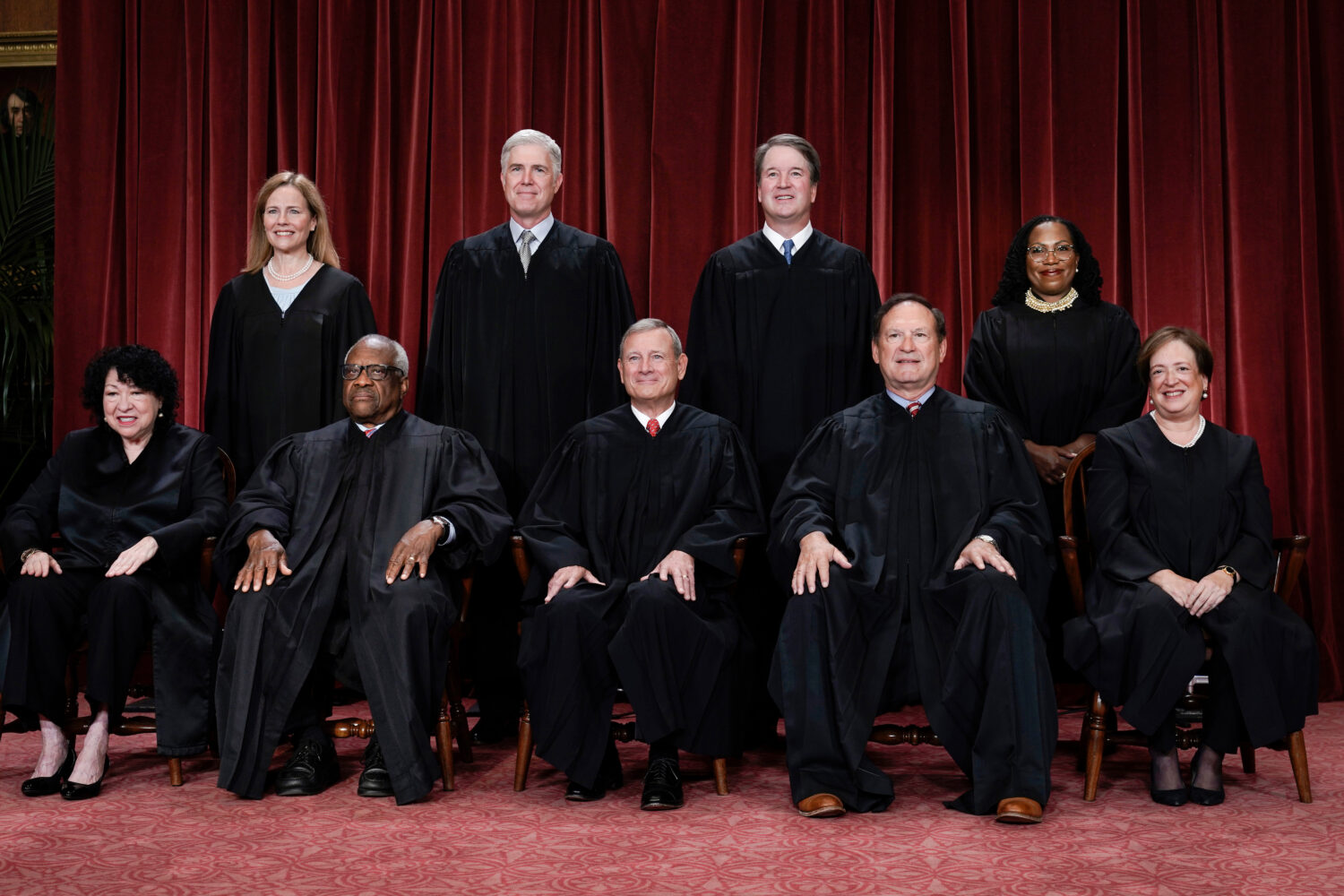 FILE - Members of the Supreme Court sit for a new group portrait at the Supreme Court building in W...