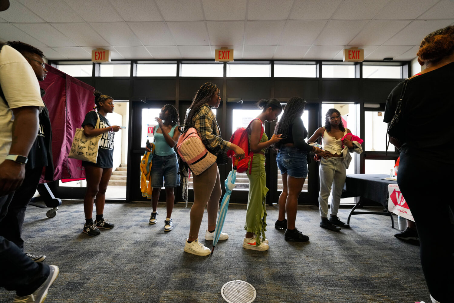 FILE - Students line up to vote at a campus polling place at Southern University in Baton Rouge, La...