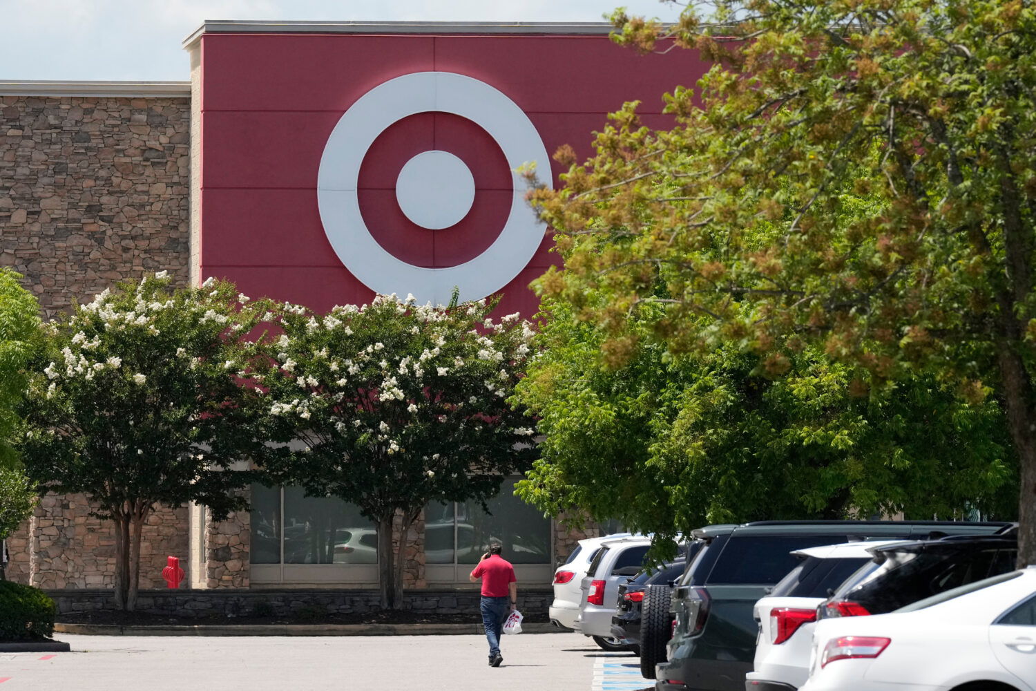 FILE - A person walks towards a Target store, July 15, 2025, in Nashville, Tenn. (AP Photo/George W...