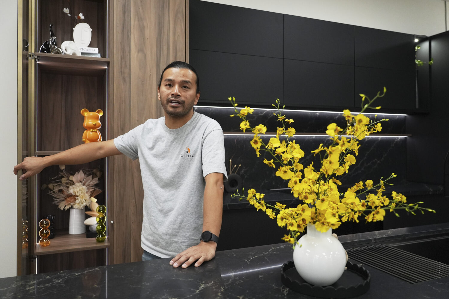 Josh Qian, co-founder of Linq Kitchen, a designer and maker of kitchen cabinets, shows his company'...