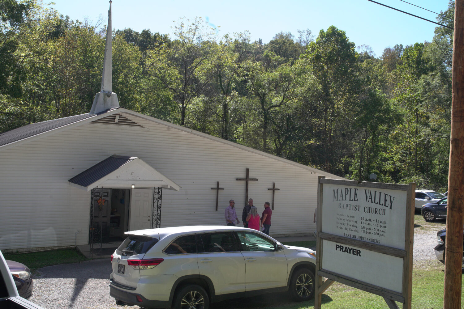 Congregants stand outside Maple Valley Baptist Church in McEwen, Tenn., Sunday, Oct. 12, 2025, abou...