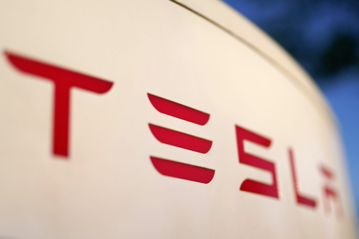 FILE - The logo for the Tesla Supercharger station is seen in Buford, Ga, April 22, 2021. (AP Photo...