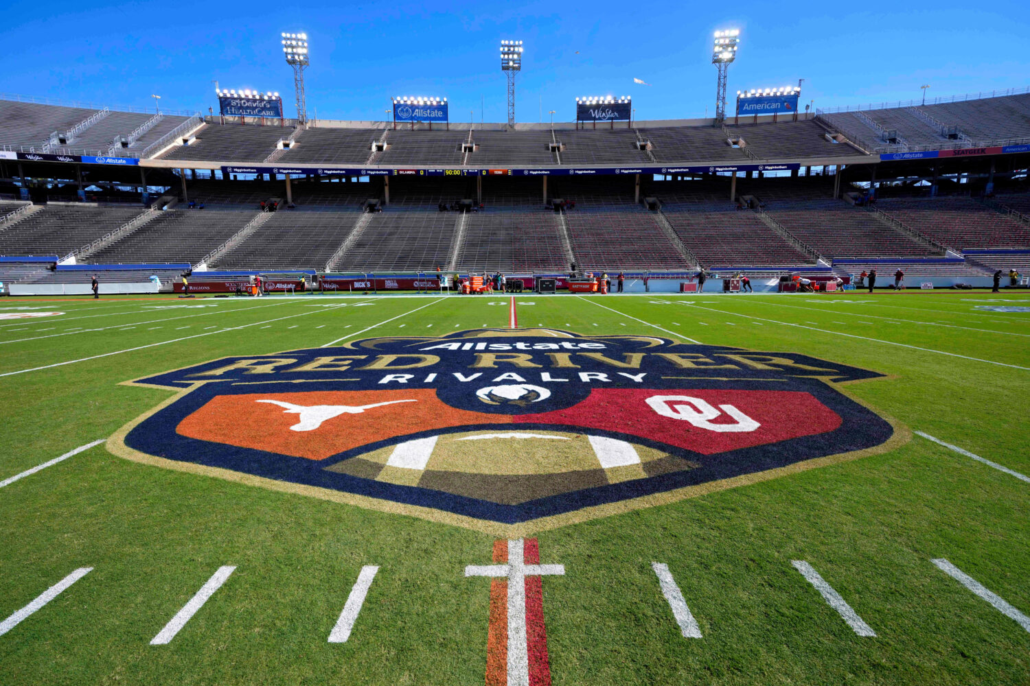 The logo of the Allstate Red River Rivalry is painted at midfield of the Cotton Bowl before an NCAA...
