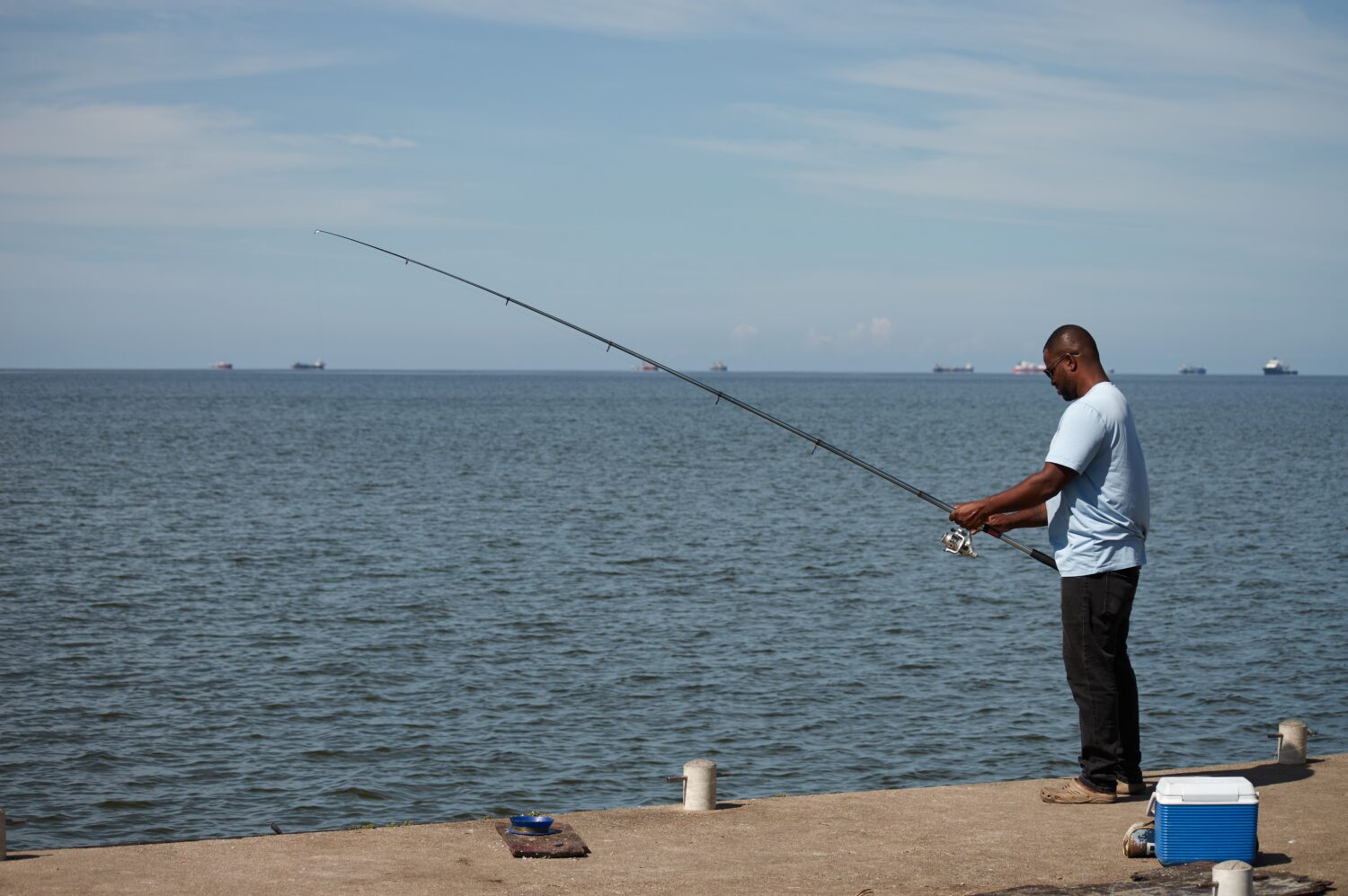 A man fishes in Cocorite, Trinidad and Tobago, Friday, Oct. 3, 2025. (AP Photo/Anselm Gibbs)Credit:...