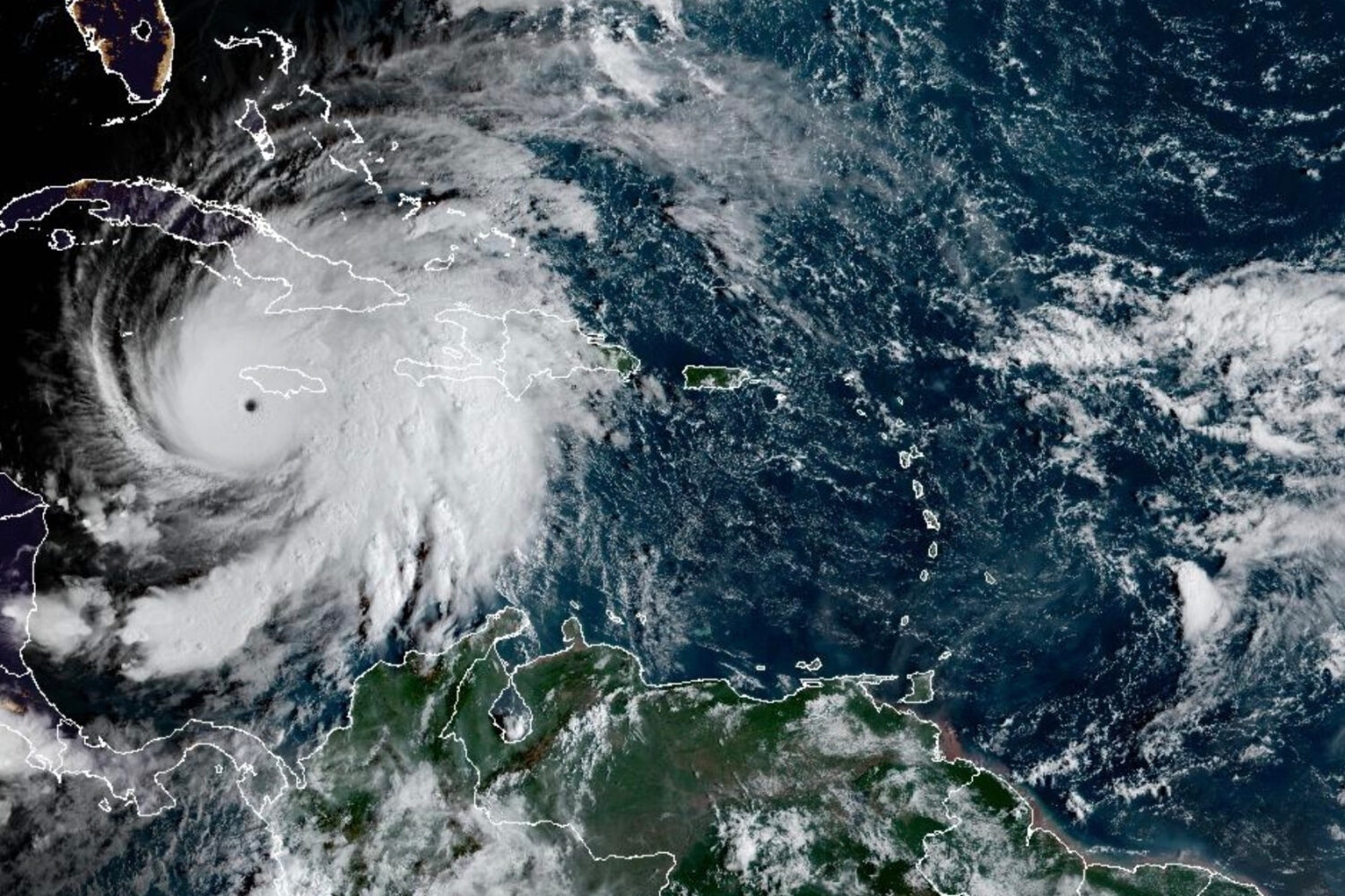 This satellite image provided by the National Oceanographic and Atmospheric Administration shows Hu...