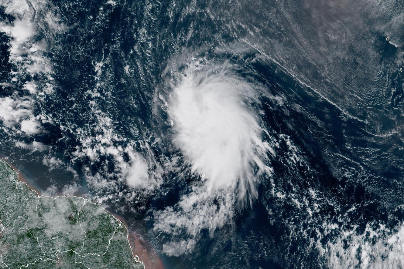 This satellite image provided by the National Oceanic and Atmospheric Administration (NOAA) shows T...