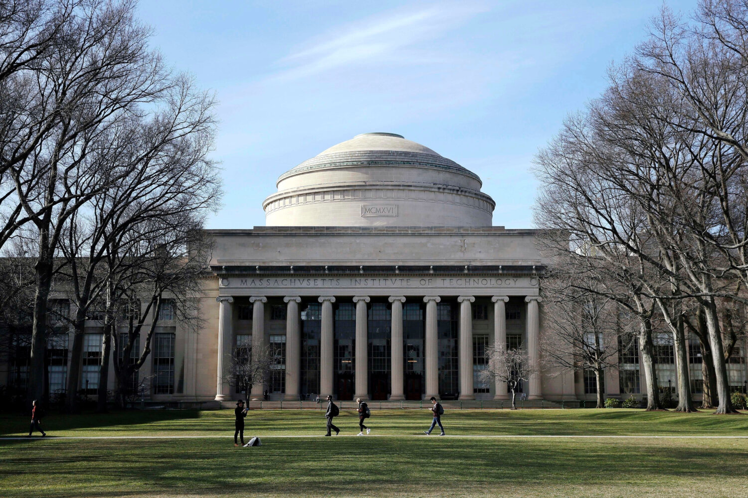 FILE - Students walk past the "Great Dome" atop Building 10 on the Massachusetts Institute of Techn...