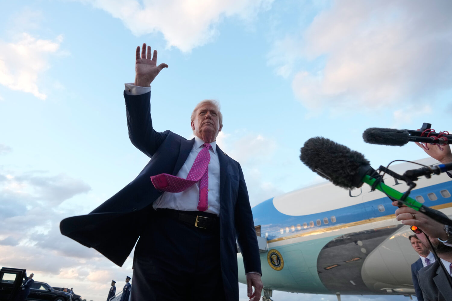 President Donald Trump waves after arriving on Air Force One, Friday, Oct. 17, 2025, at Palm Beach ...