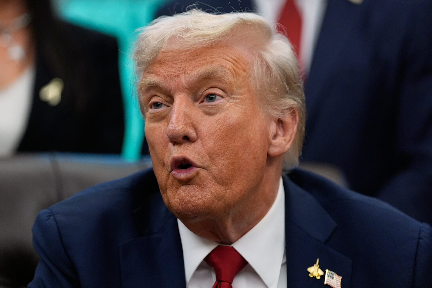 President Donald Trump speaks in the Oval Office of the White House before signing an executive ord...