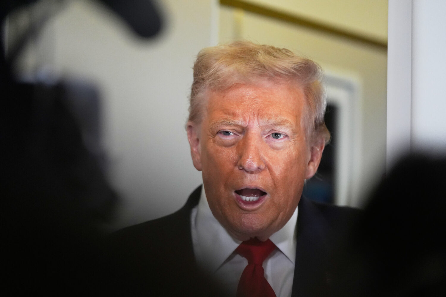 President Donald Trump speaks to the media after boarding Air Force One at Joint Base Andrews, Md.,...