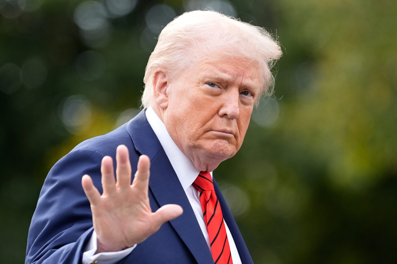 President Donald Trump walks on the South Lawn after arriving on Marine One at the White House, Fri...