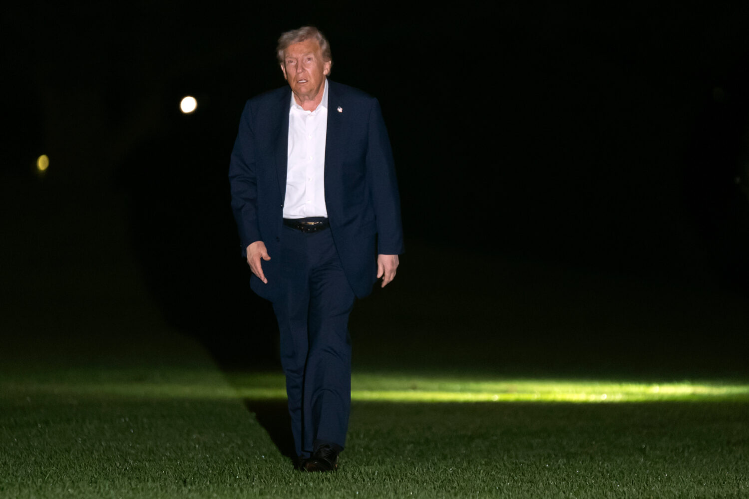 President Donald Trump walks across the South Lawn of the White House, early Tuesday, Oct. 14, 2025...