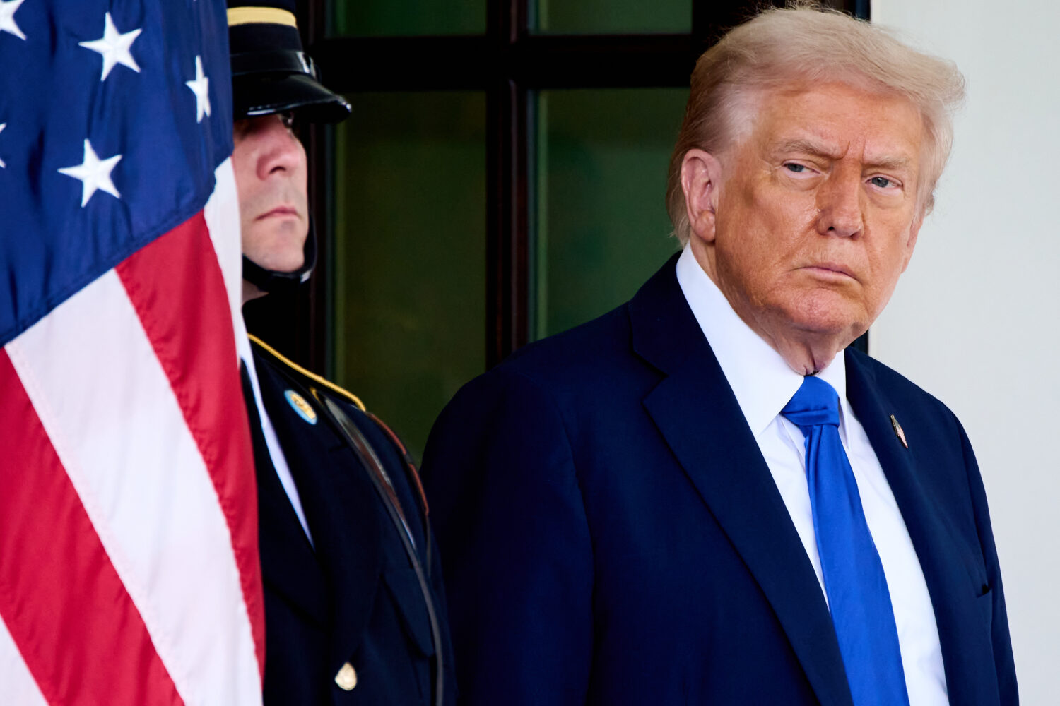 President Donald Trump waits to greet Canada's Prime Minister Mark Carney, as Carney arrives at the...