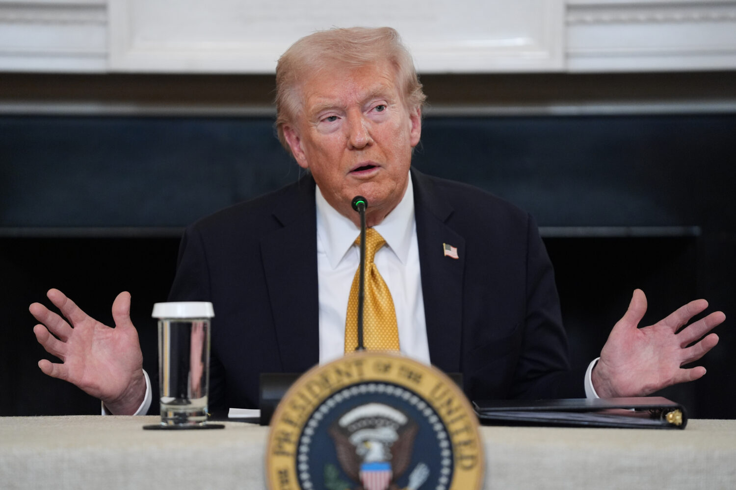 President Donald Trump answers questions from reporters during a roundtable on criminal cartels in ...