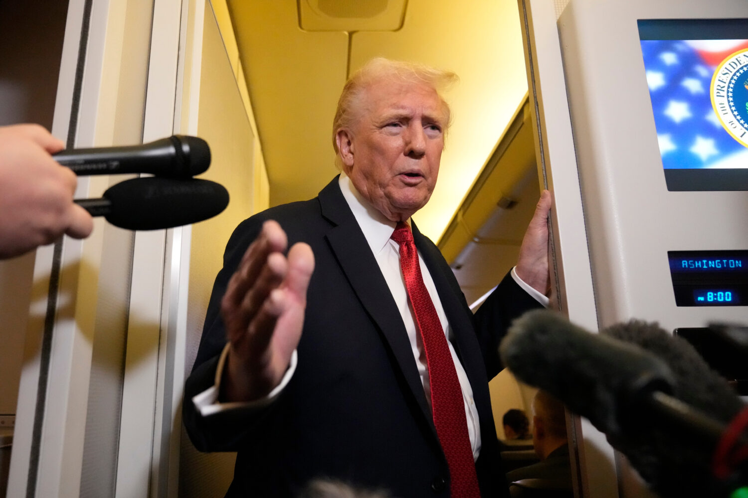 President Donald Trump speaks to reporters aboard Air Force One, Sunday, Oct. 19, 2025, en route to...