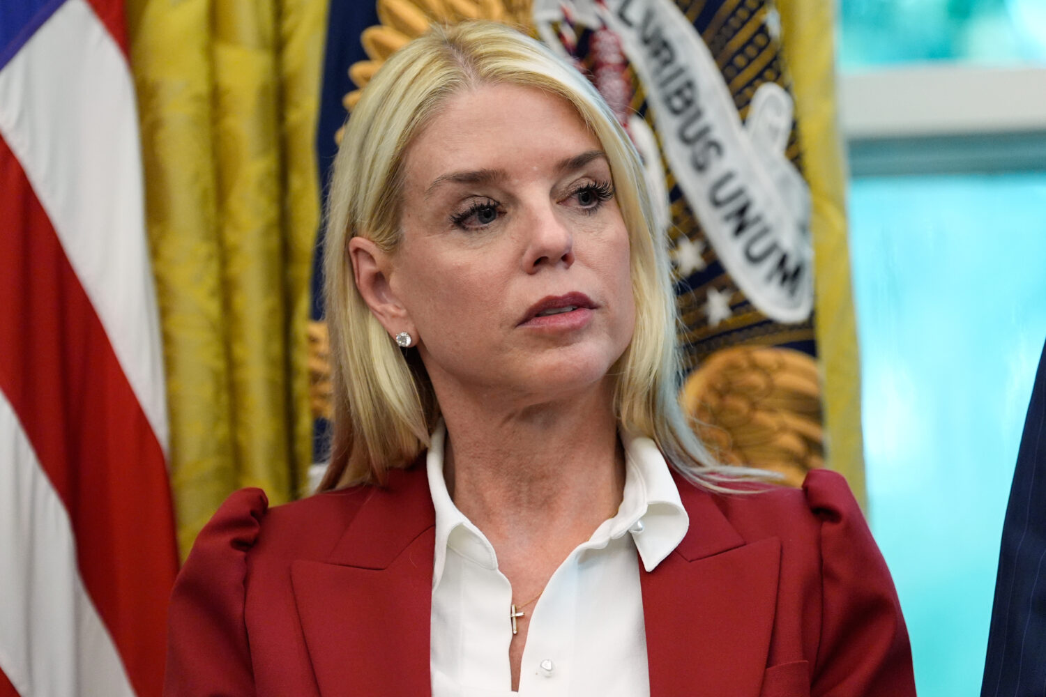 Attorney General Pam Bondi listens as President Donald Trump signs a presidential memorandum on the...