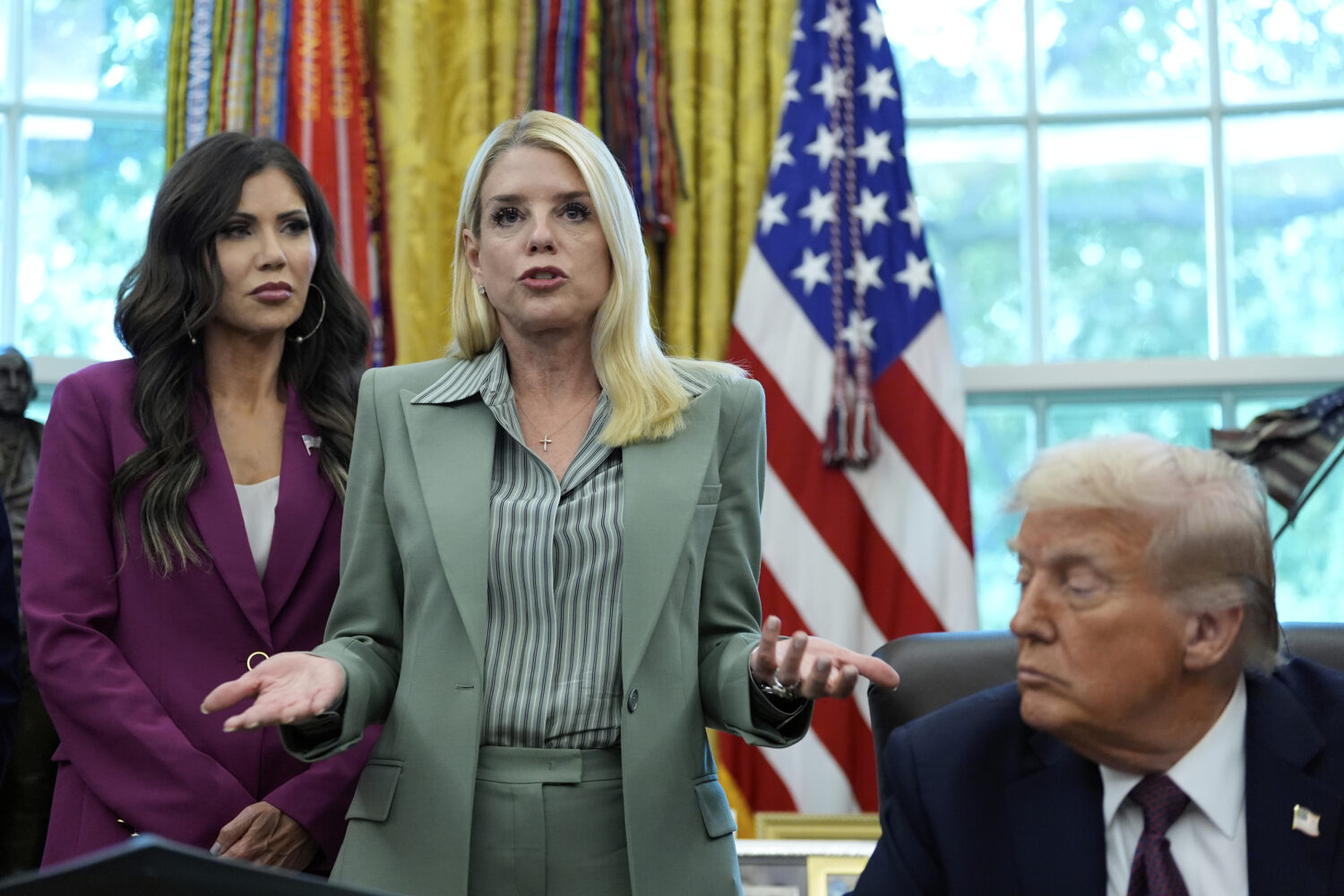 Attorney General Pam Bondi speaks as Homeland Security Secretary Kristi Noem, left, and President D...