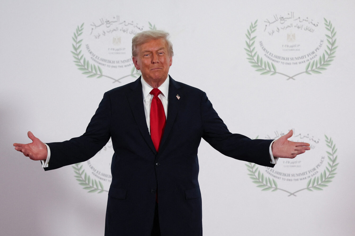 President Donald Trump waits to greet leaders during a summit to support ending the more than two-y...