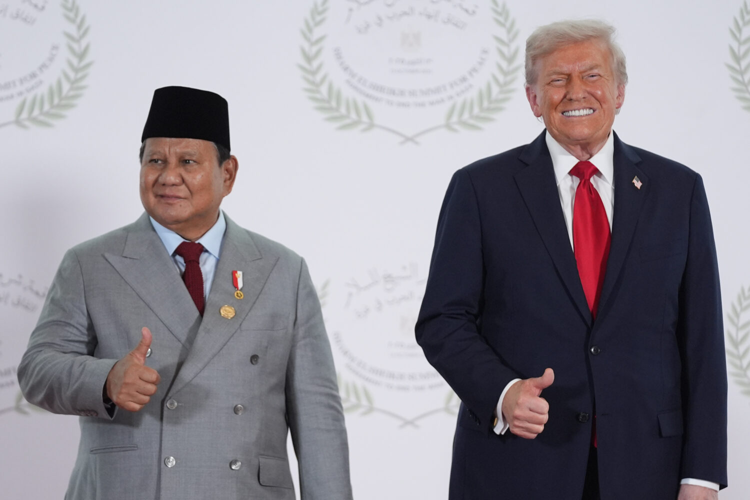 President Donald Trump greets Indonesia's President Prabowo Subianto during a summit to support end...