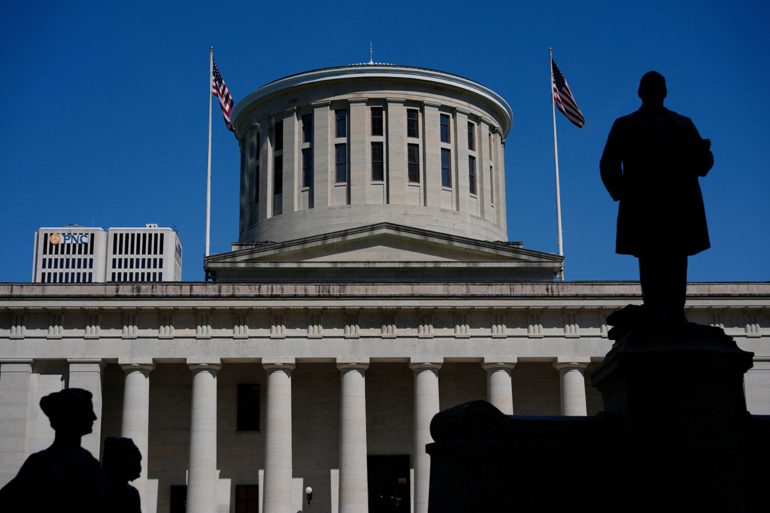 FILE - The William McKinley Monument is silhouetted in front of the west side of the Ohio Statehous...