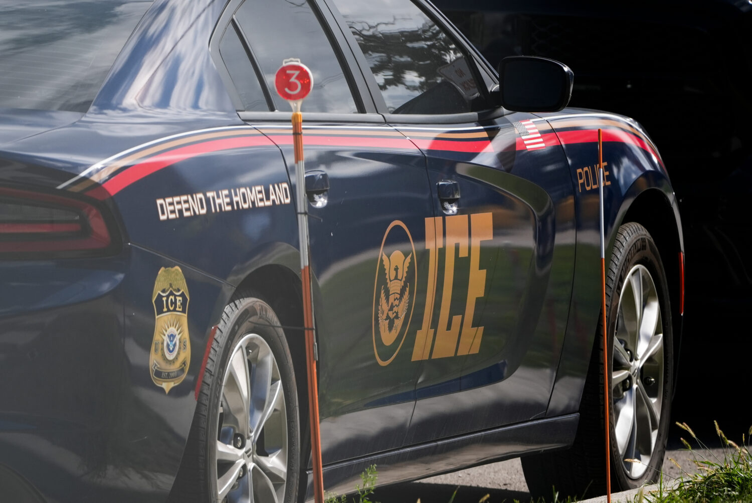 An Immigration and Customs Enforcement vehicle is parked outside the U.S. Immigration and Customs E...