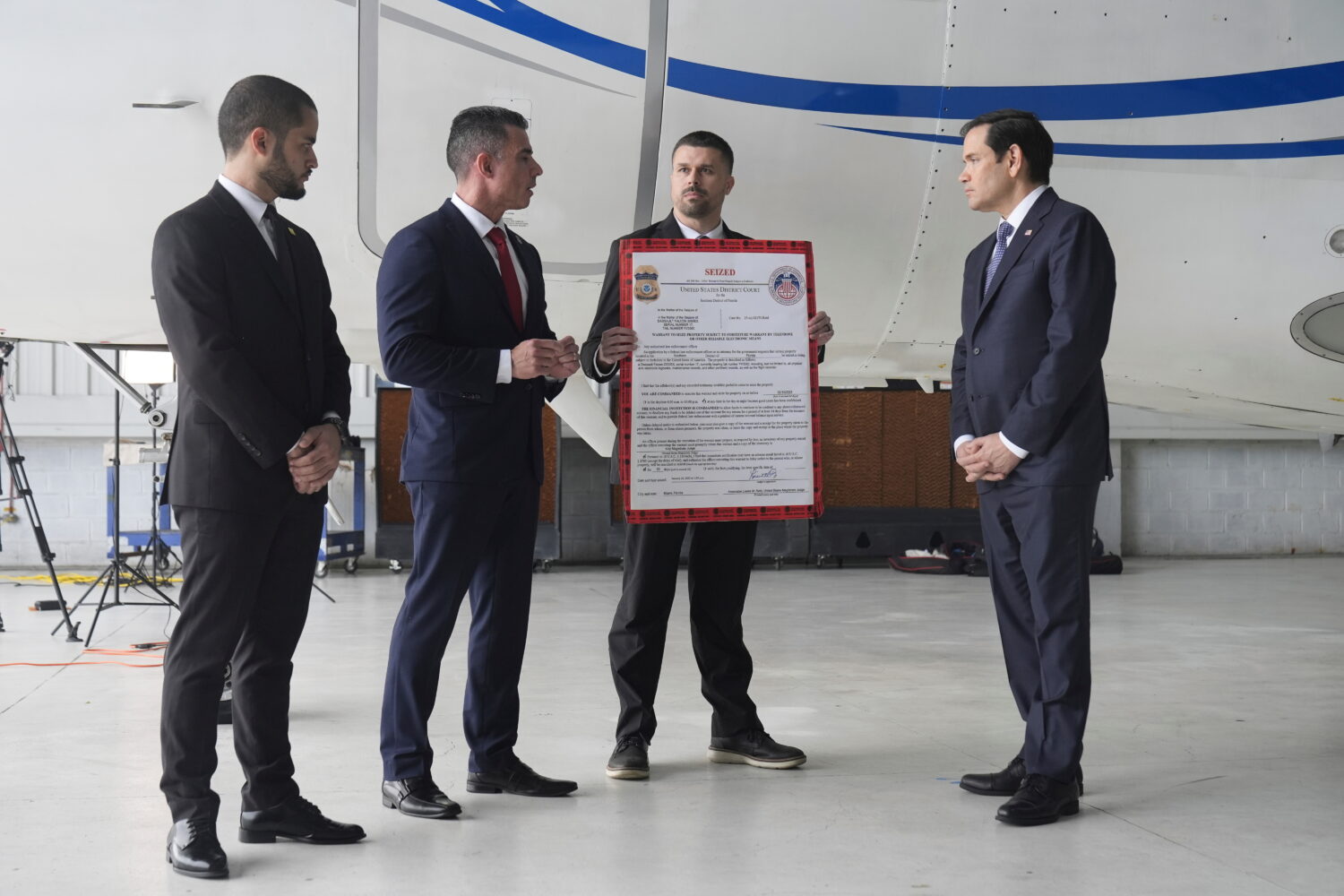FILE - U.S. Secretary of State Marco Rubio, right, listens to Edwin F. Lopez, the attaché for DHS ...