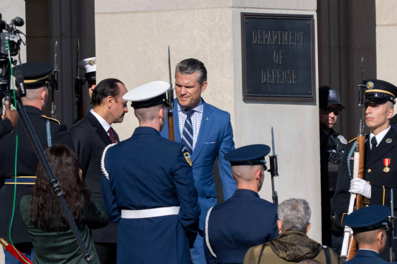 Defense Secretary Pete Hegseth, center, welcomes Qatar Minister of Defense Sheikh Saoud Al Thani to...