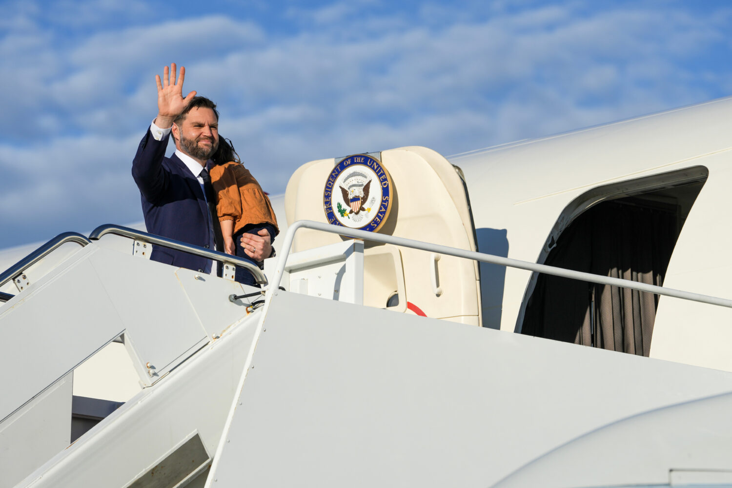 Vice President JD Vance waves as he boards Air Force Two at Joint Base Andrews, Md., Friday, Oct. 1...